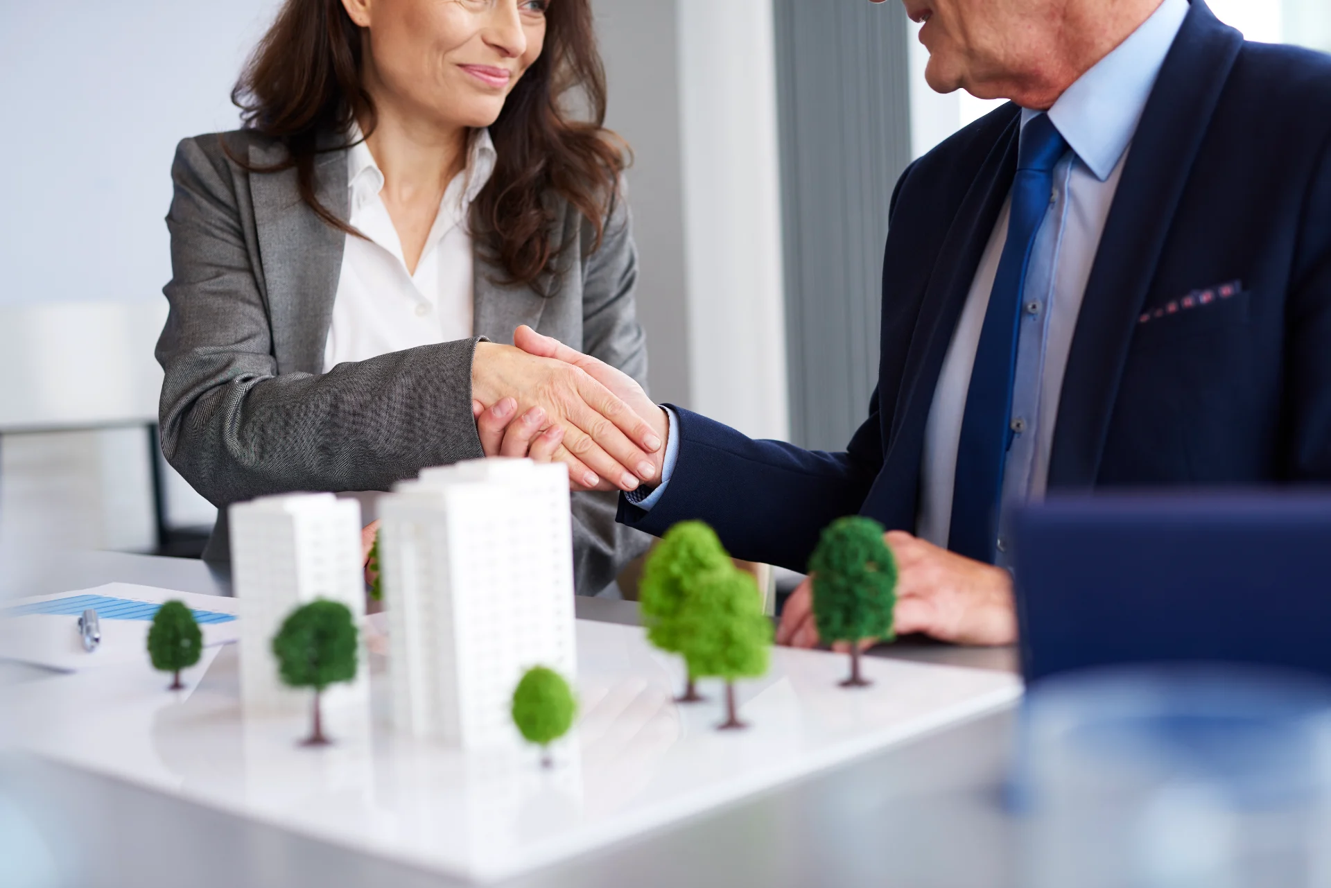 Business partners shaking hands after finalizing an insurance agreement