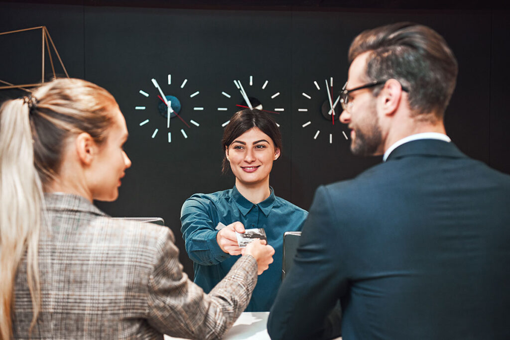 Insurance consultant reviewing commercial insurance documents with a client