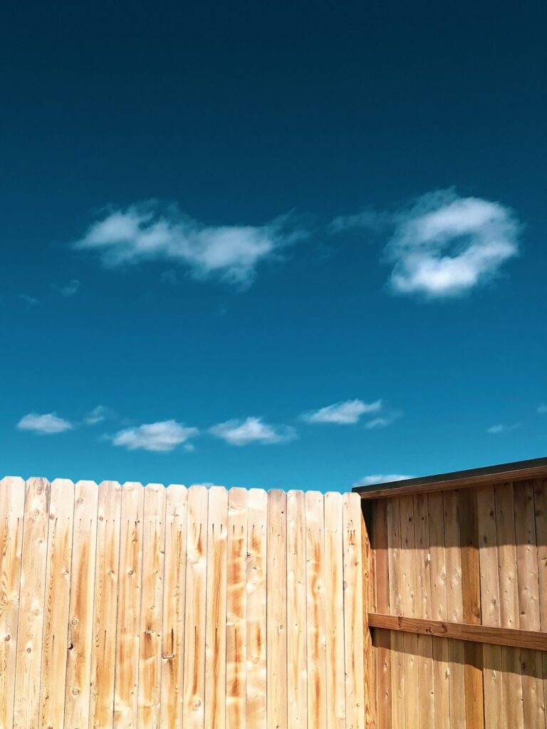 Timber fence installation, representing insurance for fencing contractors