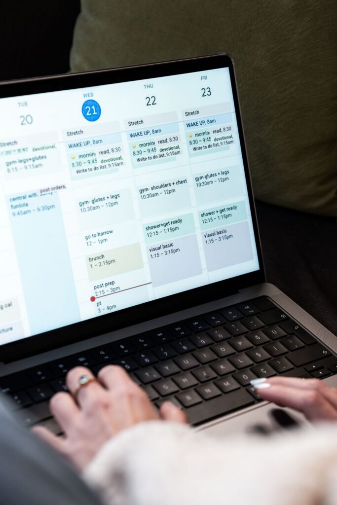 Virtual assistant managing a client schedule on a laptop