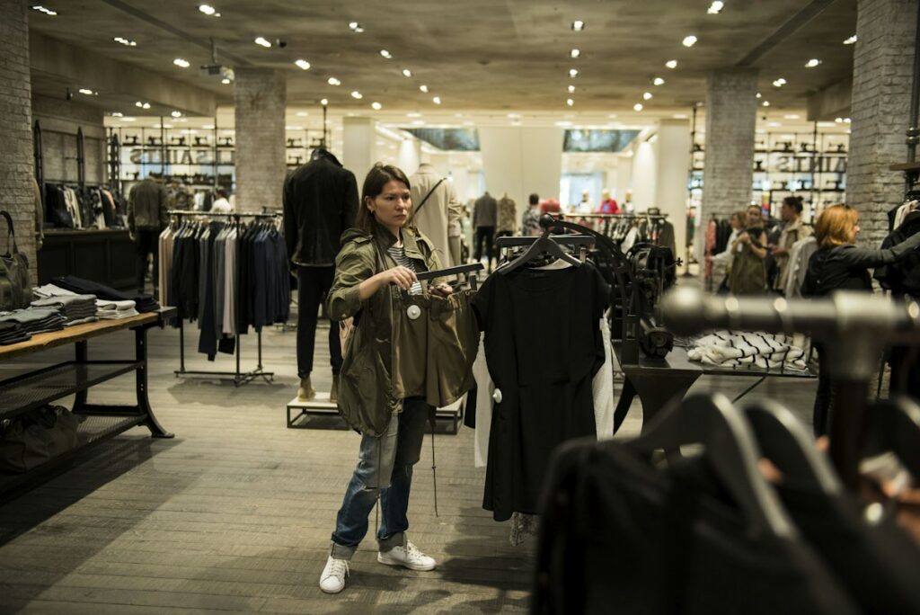 Customer browsing clothing in a retail shop